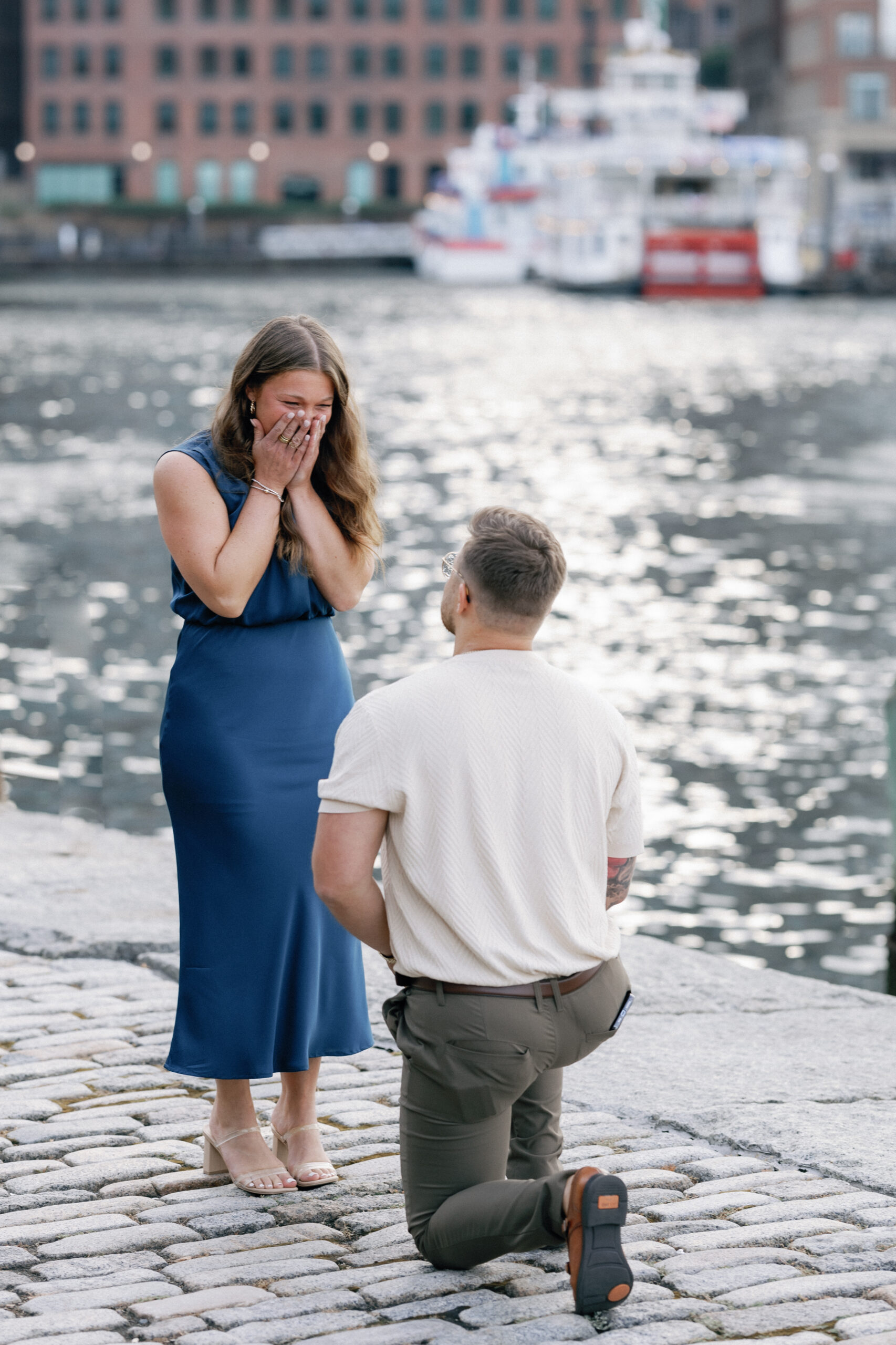 surprise boston proposal photographer fan pier